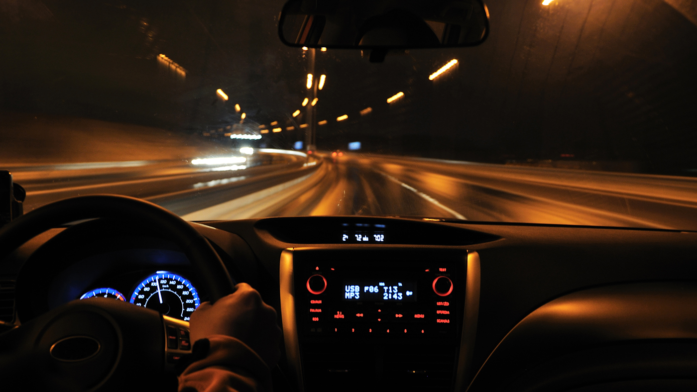 Interior of car driving at night